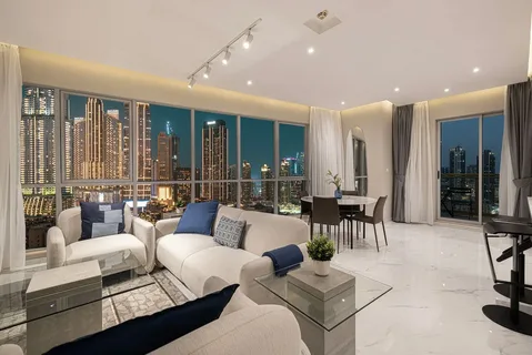 Modern living room with city skyline view at night