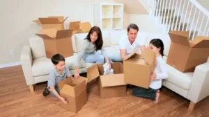 Family unpacking boxes in a living room