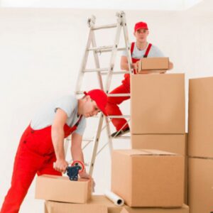 Professional movers packing boxes for home relocation